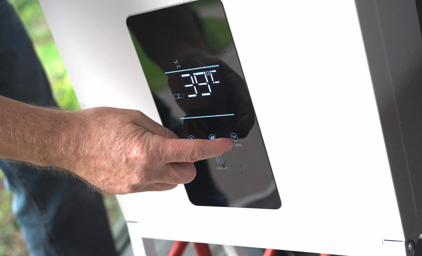 Hand on digital control panel